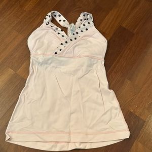 Use 4 light pink lululemon tank. Worn but well taken care of. Sold as is.